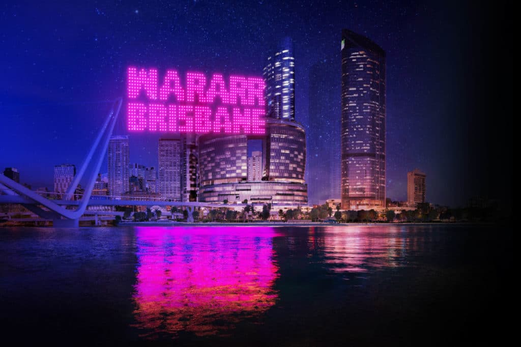 a photo of the brisbane city skyline at night lit up by lights