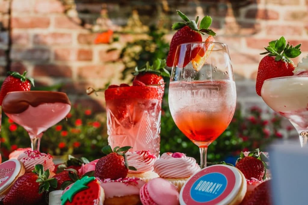 a photo of strawberries and strawberry-infused drinks and desserts