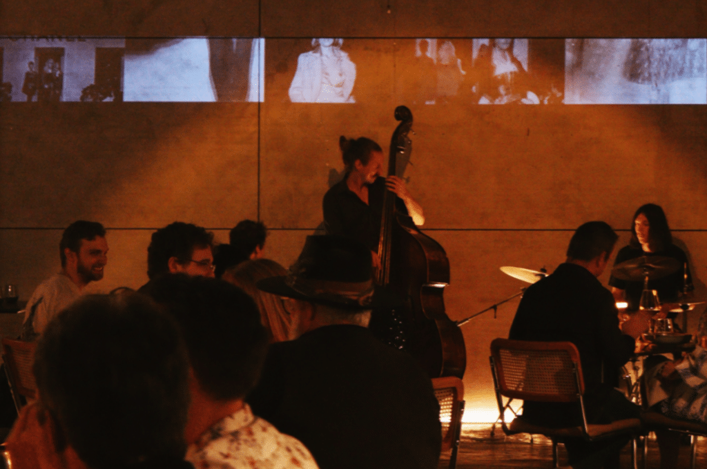 a photo of a jazz band playing in an ambient bar restaurant setting