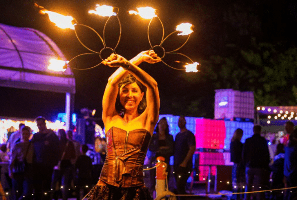 a photo of a woman fire twirling