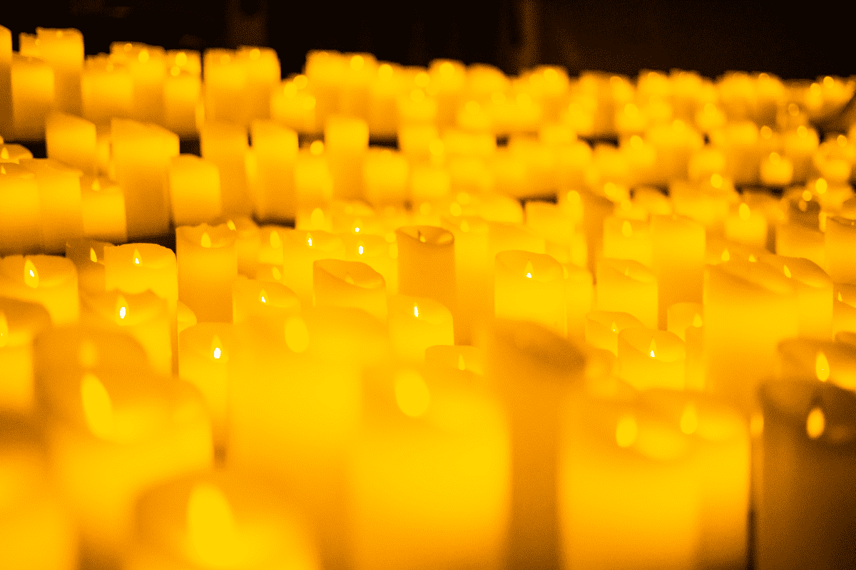 A close up of hundreds of candles.