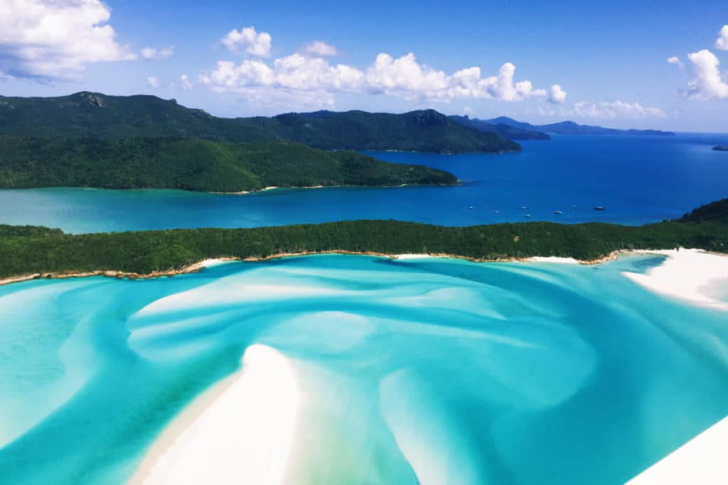 an aerial photo of whitehaven beach in queensland