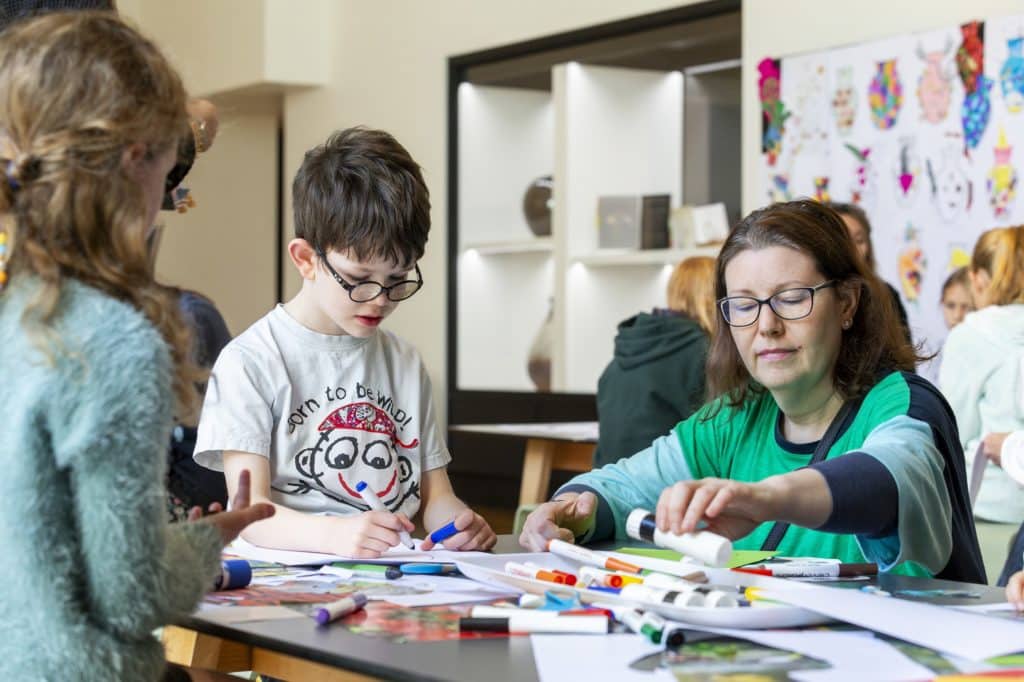 a photo of children doing arts and craft