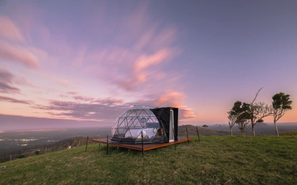 a photo of a bubble dome overlooking the sunshine coast hinterland